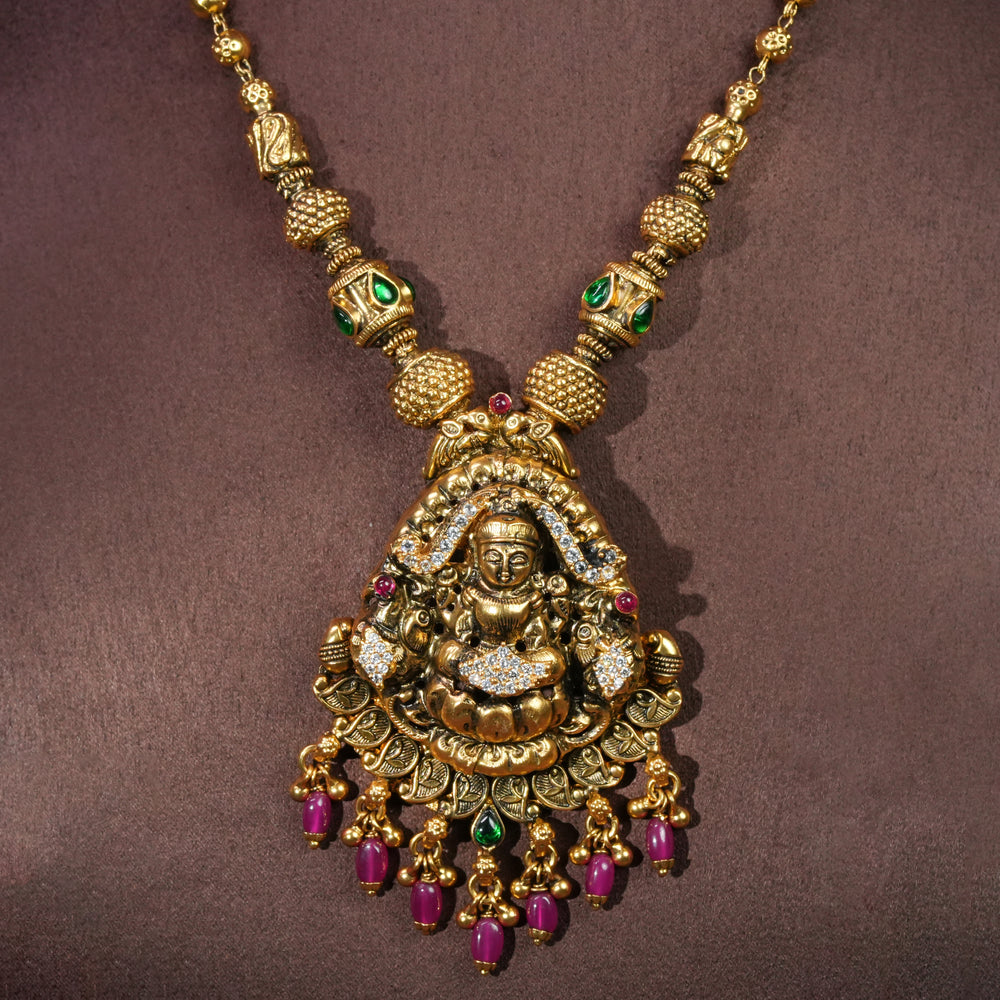 92.5 sterling silver temple necklace with Lakshmi pendant, cz stone accents, antique gold finish, and traditional South Indian bridal jewellery design by Sri Fine Jewellery Hyderabad.
