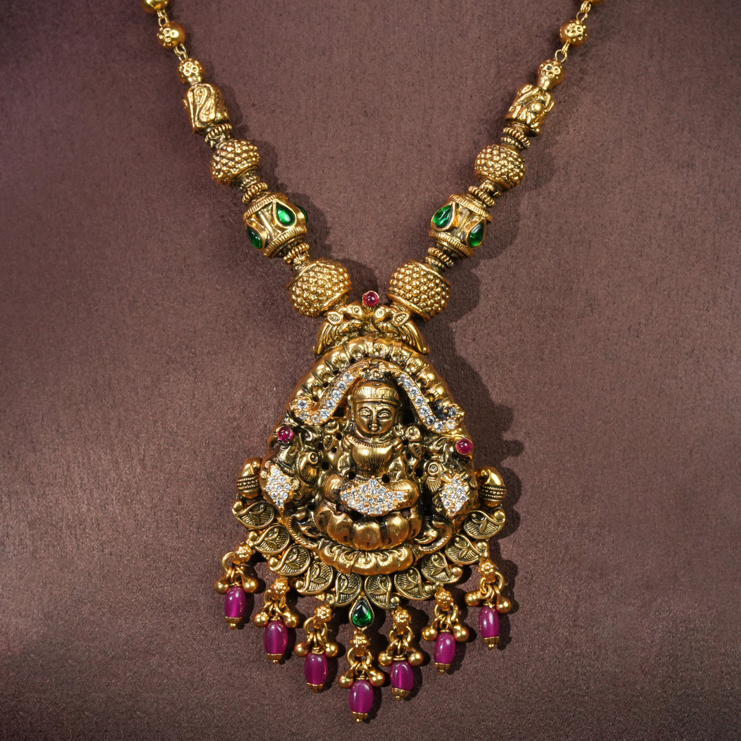 92.5 sterling silver temple necklace with Lakshmi pendant, cz stone accents, antique gold finish, and traditional South Indian bridal jewellery design by Sri Fine Jewellery Hyderabad.
