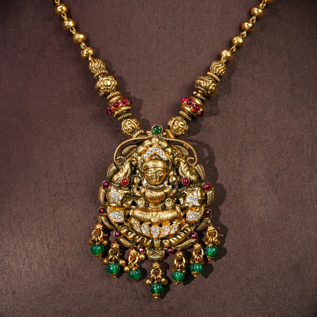 92.5 sterling silver temple necklace with Lakshmi pendant, cz stone accents, antique gold finish, and traditional South Indian bridal jewellery design by Sri Fine Jewellery Hyderabad.
