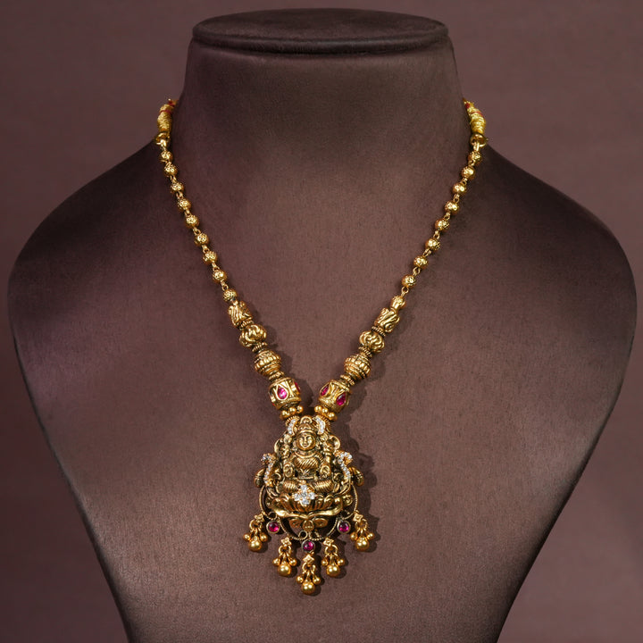92.5 sterling silver temple choker necklace with Lakshmi pendant, ruby stone accents, antique gold finish, and traditional South Indian bridal jewellery design by Sri Fine Jewellery Hyderabad.
