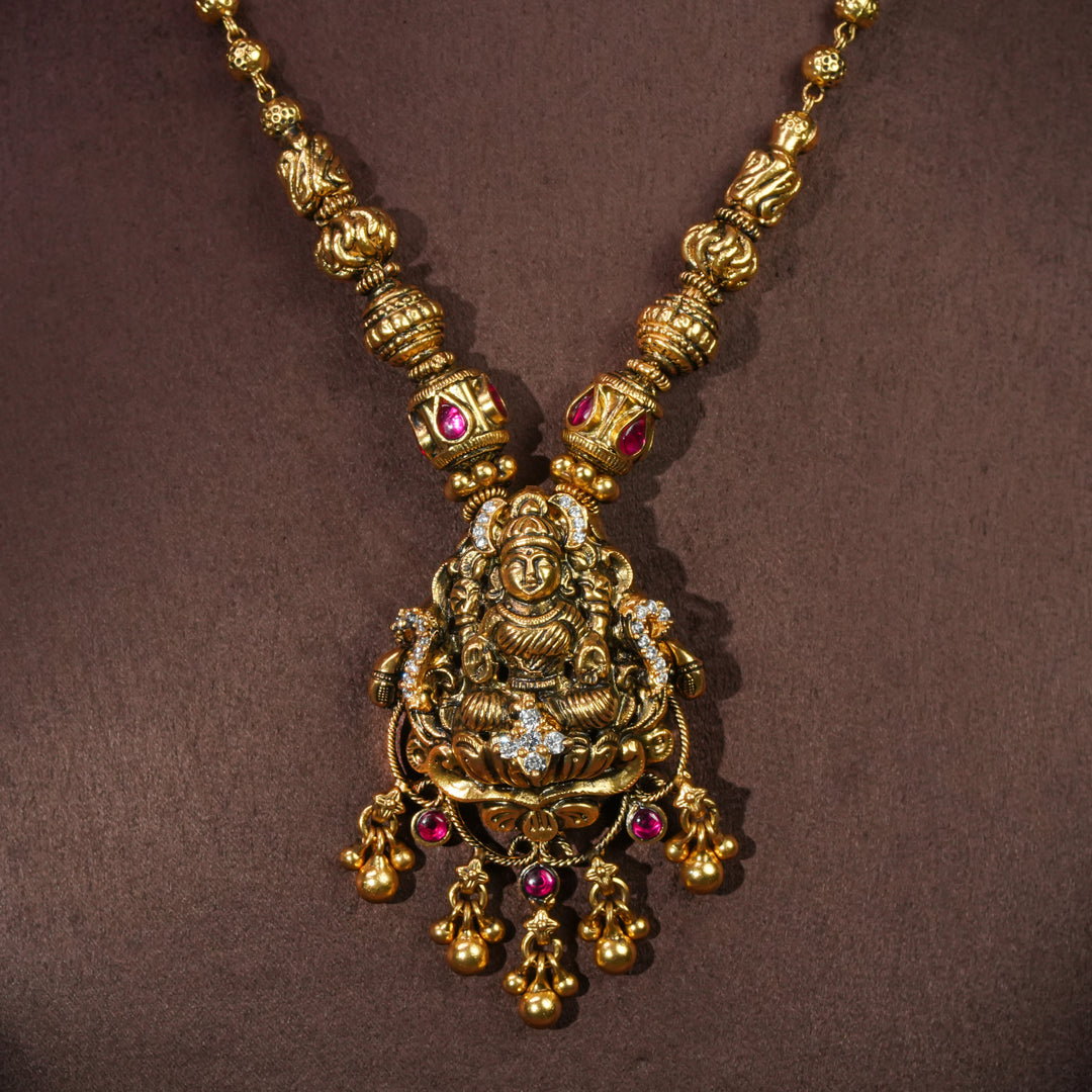 92.5 sterling silver temple choker necklace with Lakshmi pendant, ruby stone accents, antique gold finish, and traditional South Indian bridal jewellery design by Sri Fine Jewellery Hyderabad.
