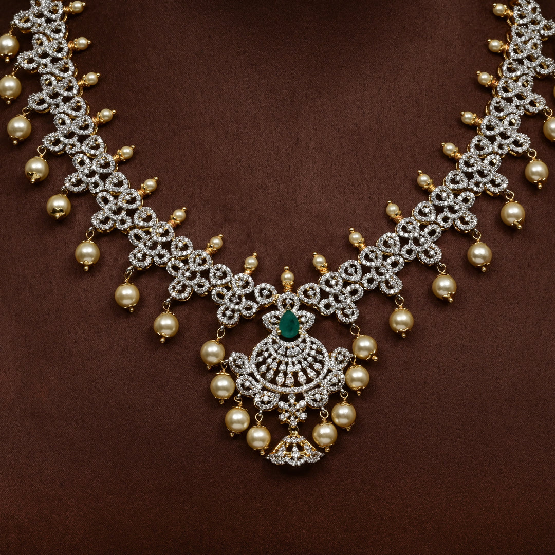  Close-up of Hriday collection of 92.5 silver short necklace with CZ stones, intricate floral motifs, and pendant design for bridal and festive wear by Sri fine jewellery, Hyderabad.