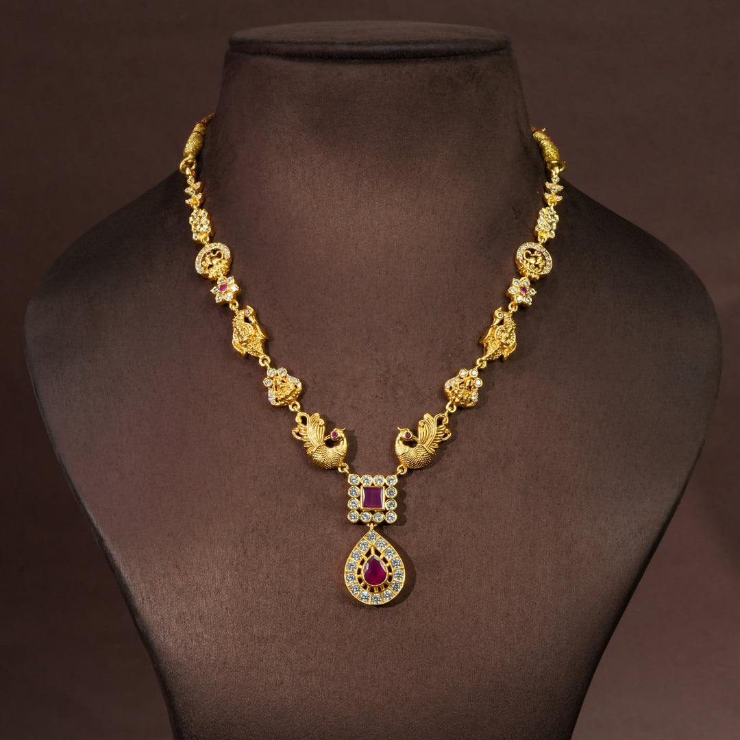 Traditional 92.5 silver temple necklace with peacock motifs, ruby stone detailing, and intricate heritage craftsmanship by Sri Fine Jewellery Hyderabad. (https://srifinejewellery.com)
