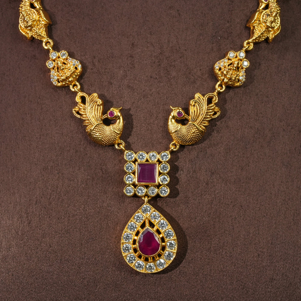 Close-up view of traditional 92.5 silver temple necklace with peacock motifs, ruby stone detailing, and intricate heritage craftsmanship by Sri Fine Jewellery Hyderabad (https://srifinejewellery.com)
