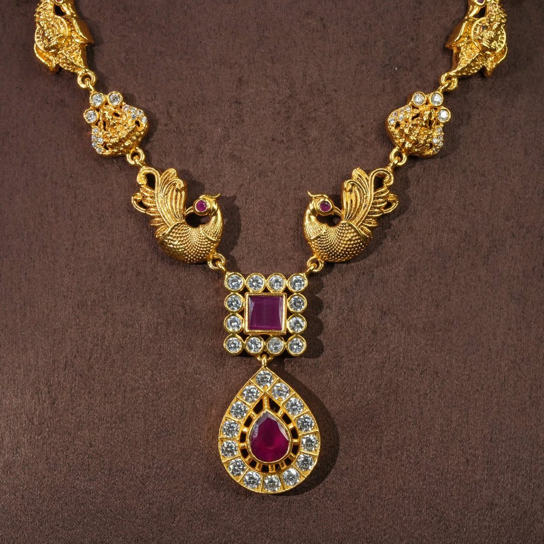 Close-up view of traditional 92.5 silver temple necklace with peacock motifs, ruby stone detailing, and intricate heritage craftsmanship by Sri Fine Jewellery Hyderabad (https://srifinejewellery.com)
