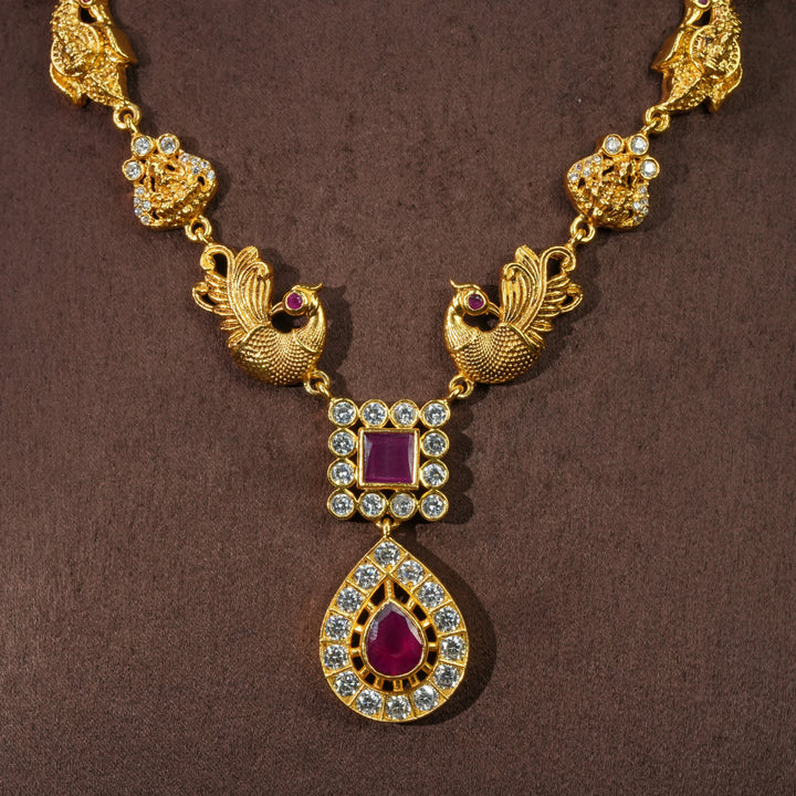 Close-up view of traditional 92.5 silver temple necklace with peacock motifs, ruby stone detailing, and intricate heritage craftsmanship by Sri Fine Jewellery Hyderabad (https://srifinejewellery.com)
