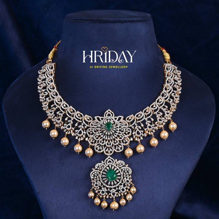 Luxury diamond-look silver cz emerald necklace with premium cz stones, semi-precious emerald stone and  pearl drops in 92.5 silver, bridal wedding jewellery with gold finish by Sri Fine Jewellery Punjagutta Hyderabad.