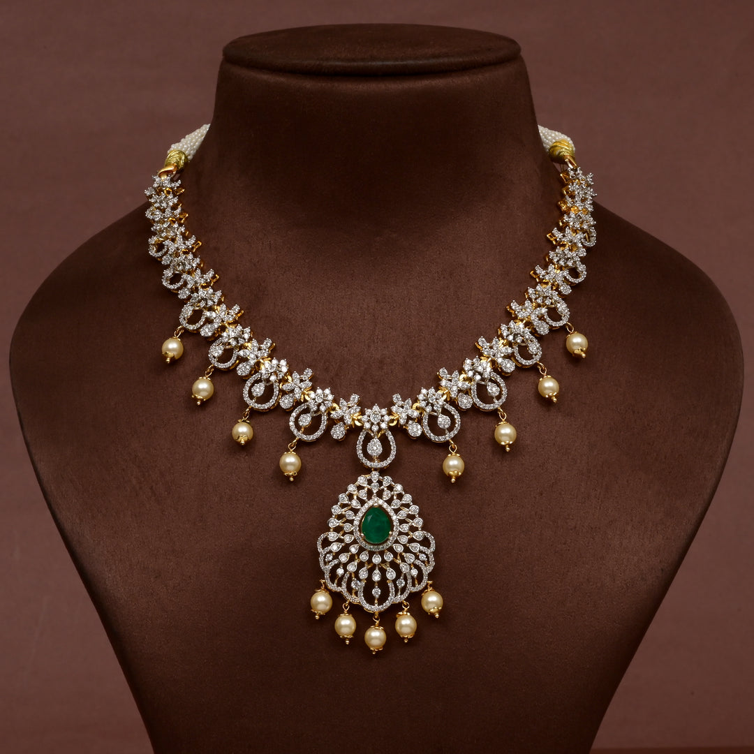 Luxury diamond-look silver cz emerald necklace with premium cz stones, semi-precious emerald stone and  pearl drops in 92.5 silver, bridal wedding jewellery with gold finish by Sri Fine Jewellery Punjagutta Hyderabad.