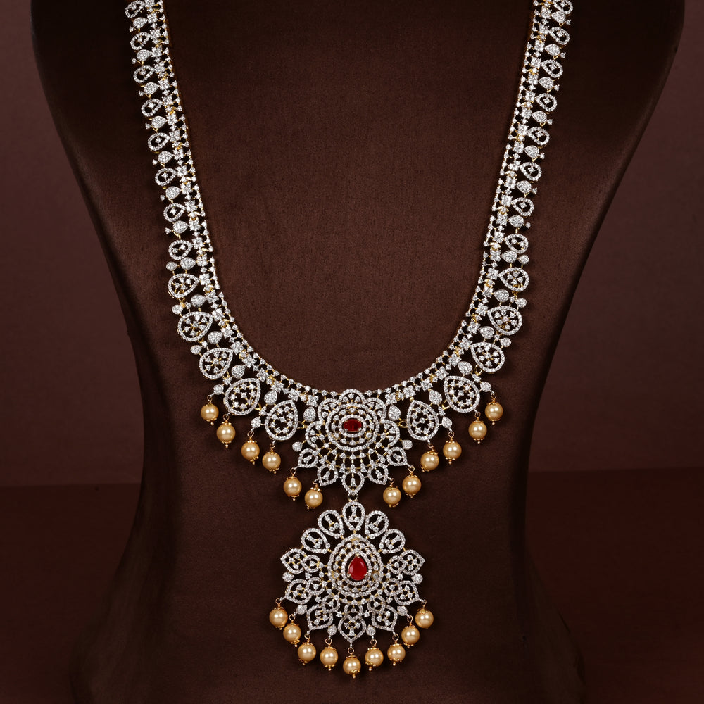 Luxury diamond-look silver cz ruby necklace with premium cz stones, semi-precious ruby stone and  pearl drops in 92.5 silver, bridal wedding jewellery with gold finish by Sri Fine Jewellery Punjagutta Hyderabad.