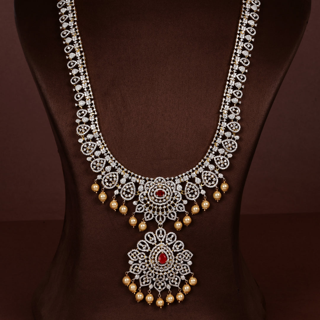 Luxury diamond-look silver cz ruby necklace with premium cz stones, semi-precious ruby stone and  pearl drops in 92.5 silver, bridal wedding jewellery with gold finish by Sri Fine Jewellery Punjagutta Hyderabad.