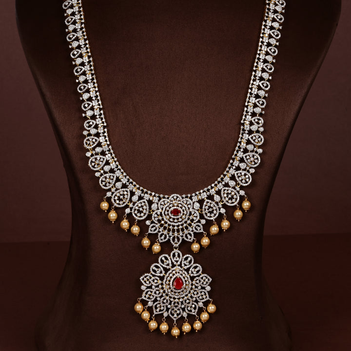 Luxury diamond-look silver cz ruby necklace with premium cz stones, semi-precious ruby stone and  pearl drops in 92.5 silver, bridal wedding jewellery with gold finish by Sri Fine Jewellery Punjagutta Hyderabad.