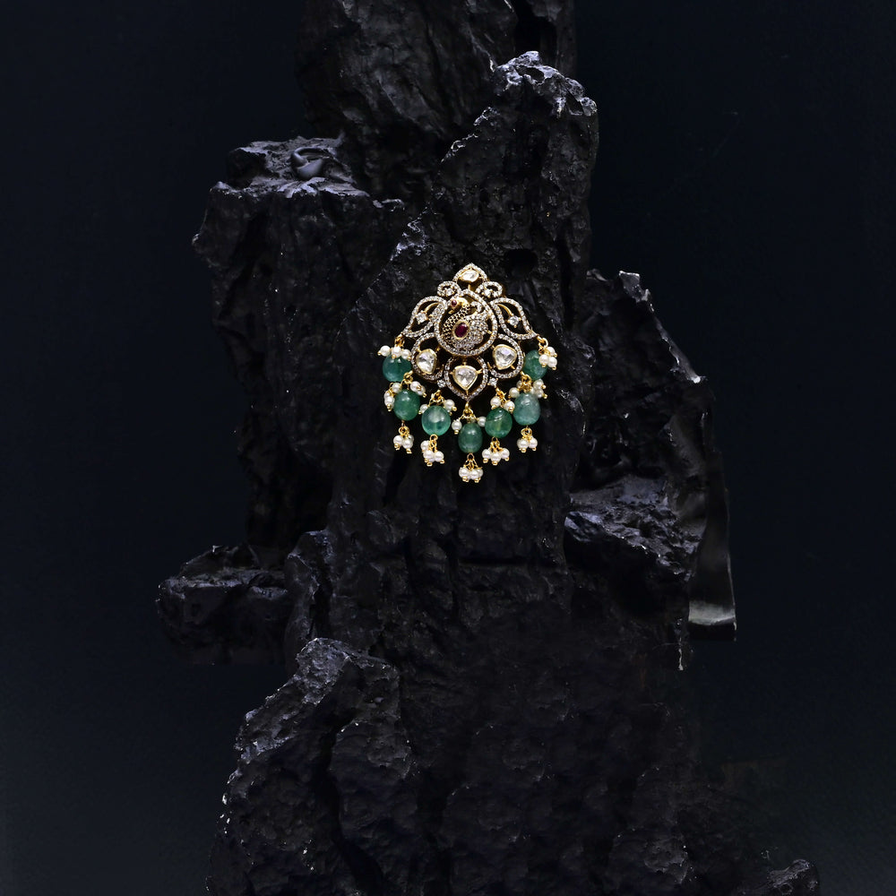 92.5 silver pendant with peacock motif, ruby stone, CZ stones, and Victorian-inspired antique finish by Sri Fine Jewellery, Hyderabad
(https://www.srifinejewellery.com)