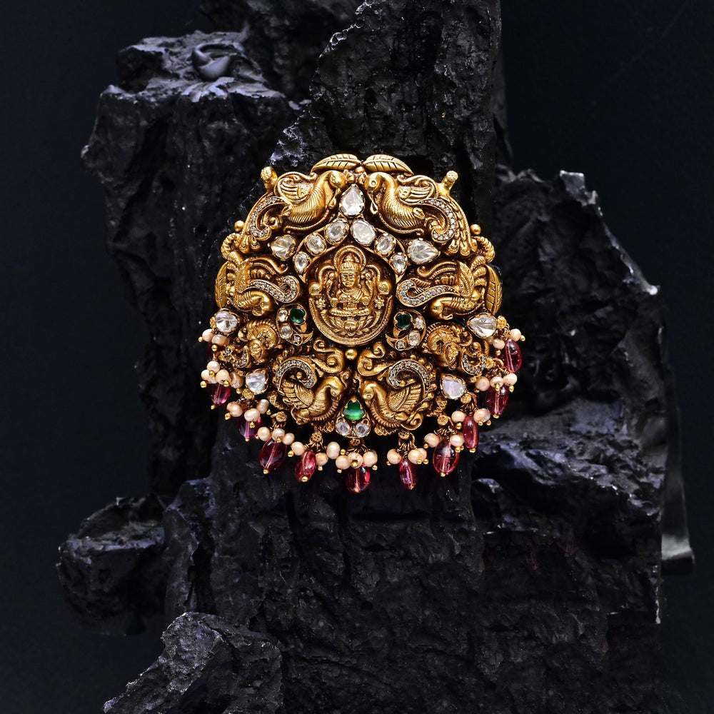 Premium 92.5 silver temple pendant featuring traditional Lakshmi motif, kemp stones, antique finish and intricate handcrafted South Indian design by Sri Fine Jewellery, Hyderabad.
(https://www.srifinejewellery.com