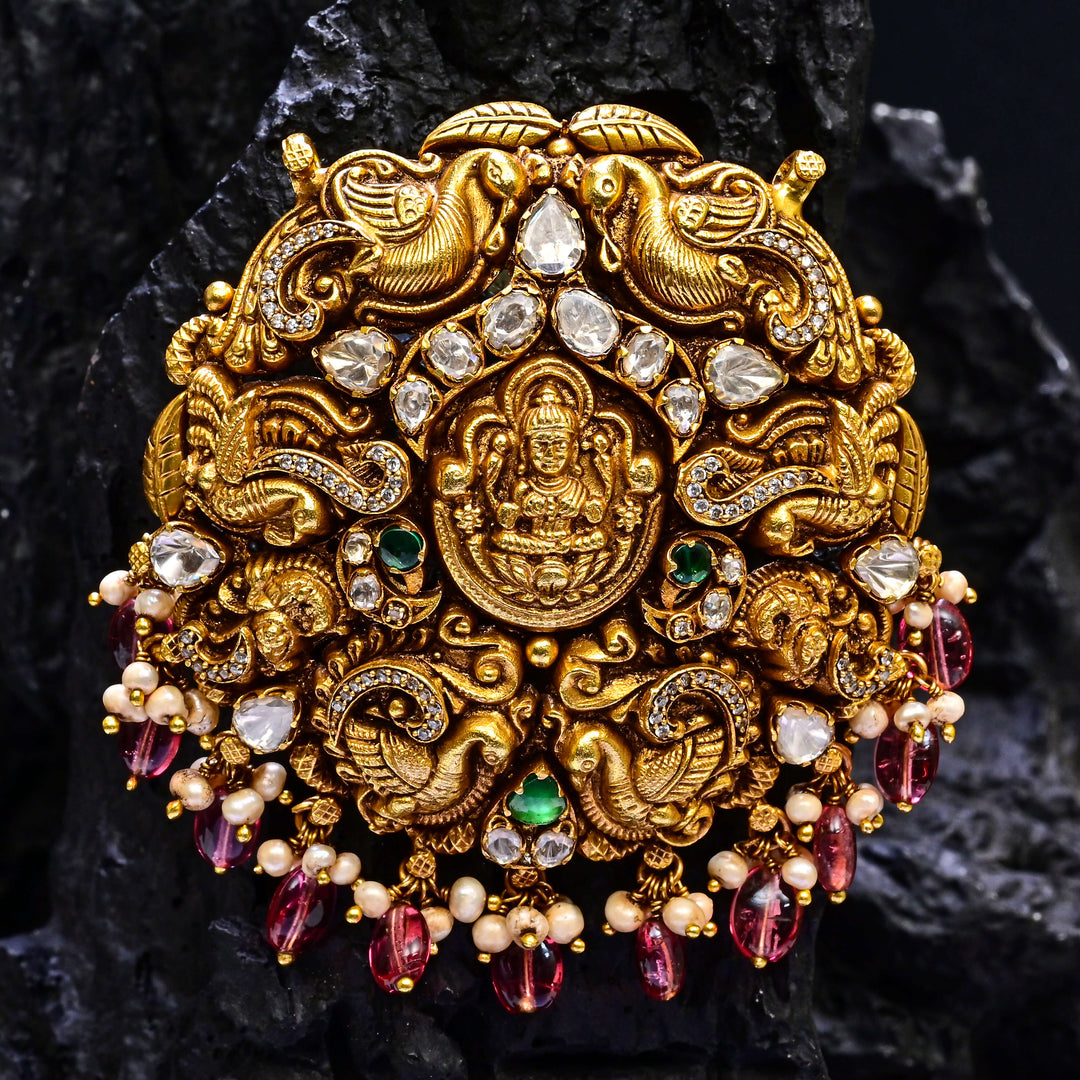 Premium 92.5 silver temple pendant featuring traditional Lakshmi motif, kemp stones, antique finish and intricate handcrafted South Indian design by Sri Fine Jewellery, Hyderabad.
(https://www.srifinejewellery.com