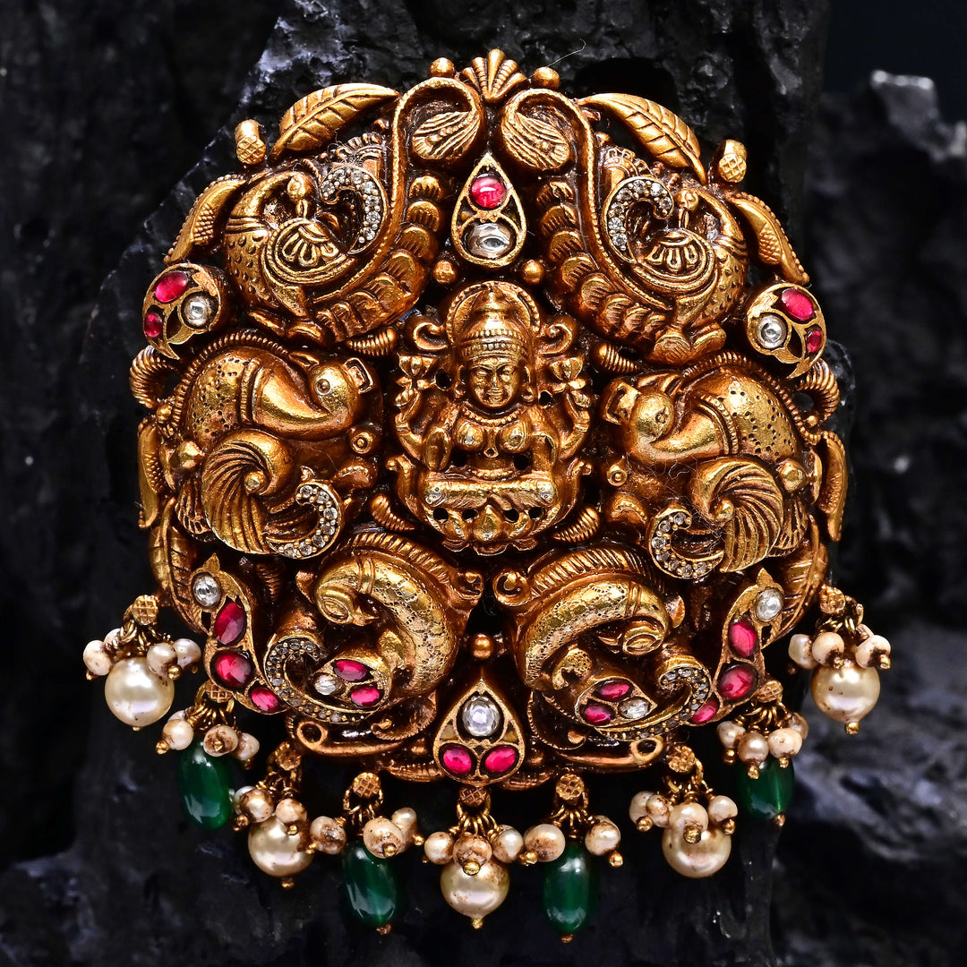 Premium 92.5 silver temple pendant featuring traditional Lakshmi motif, kemp stones, antique finish and intricate handcrafted South Indian design by Sri Fine Jewellery, Hyderabad.
(https://www.srifinejewellery.com