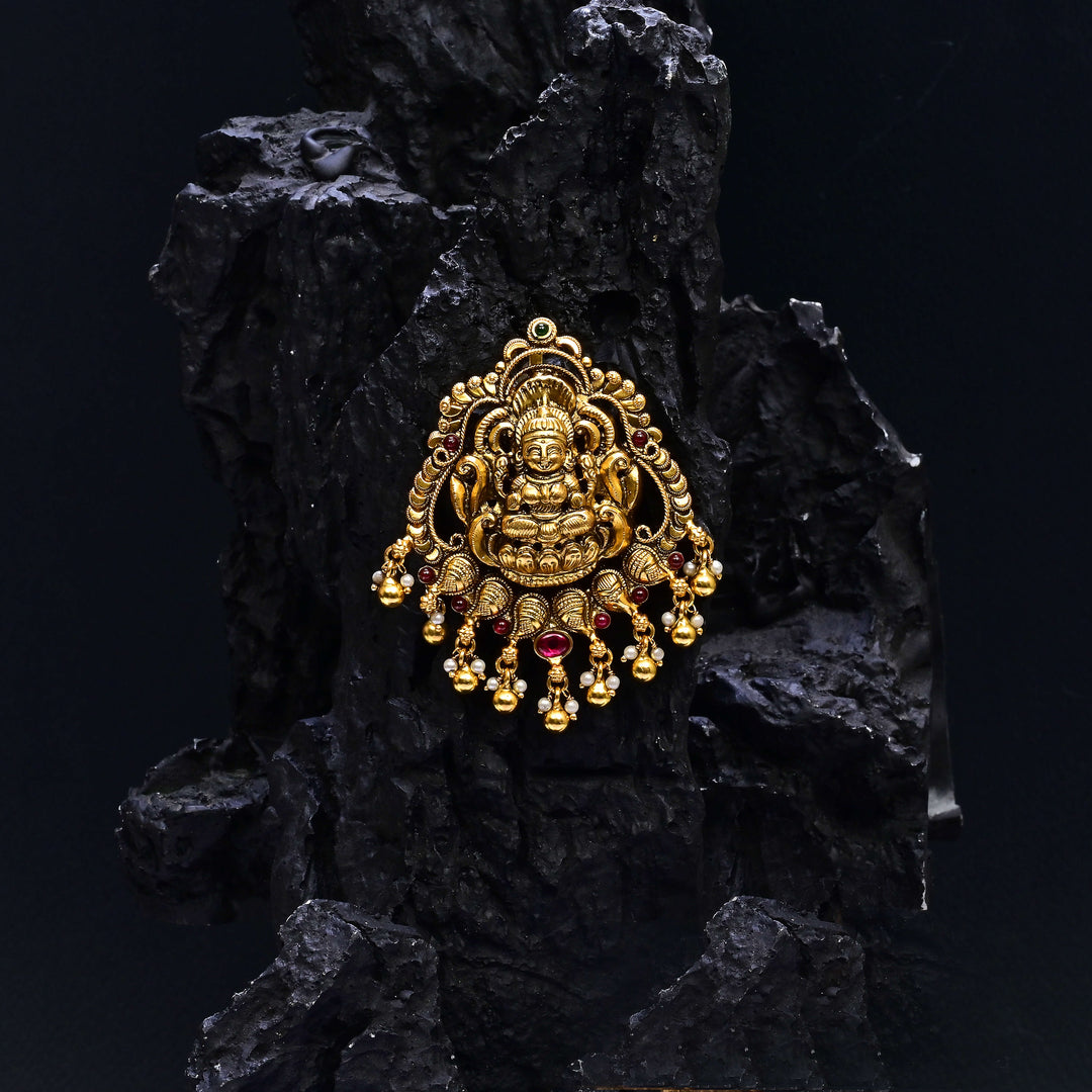 Premium 92.5 silver temple pendant featuring traditional Lakshmi motif, kemp stones, antique finish and intricate handcrafted South Indian design by Sri Fine Jewellery, Hyderabad.
(https://www.srifinejewellery.com