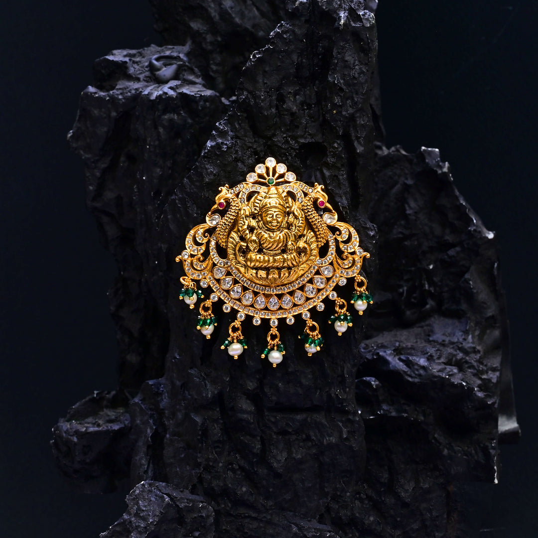 Premium 92.5 silver temple pendant featuring traditional Lakshmi motif, kemp stones, antique finish and intricate handcrafted South Indian design by Sri Fine Jewellery, Hyderabad.
(https://www.srifinejewellery.com)
