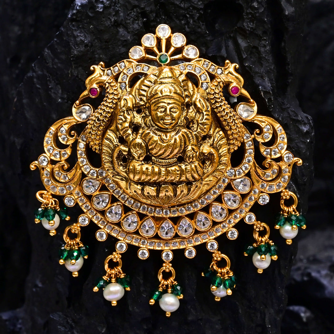 Premium 92.5 silver temple pendant featuring traditional Lakshmi motif, kemp stones, antique finish and intricate handcrafted South Indian design by Sri Fine Jewellery, Hyderabad.
(https://www.srifinejewellery.com)