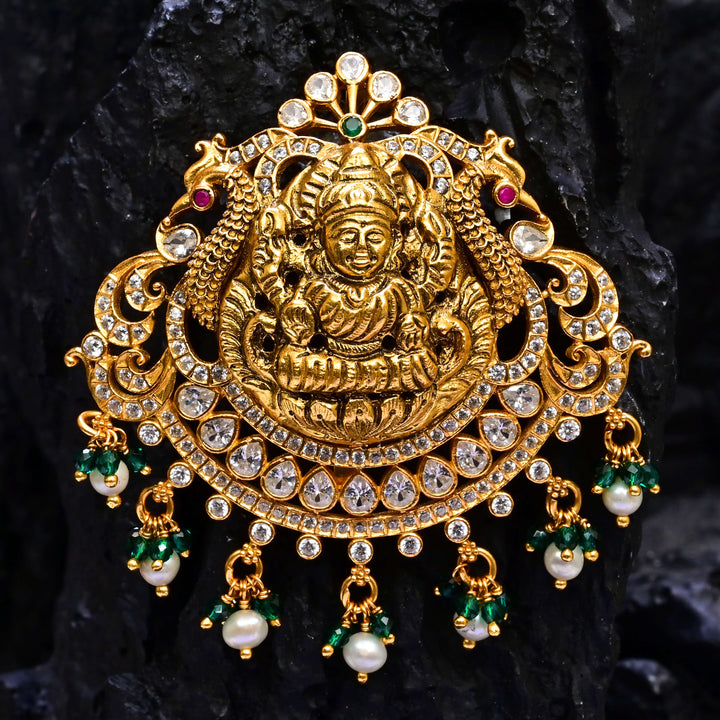Premium 92.5 silver temple pendant featuring traditional Lakshmi motif, kemp stones, antique finish and intricate handcrafted South Indian design by Sri Fine Jewellery, Hyderabad.
(https://www.srifinejewellery.com)