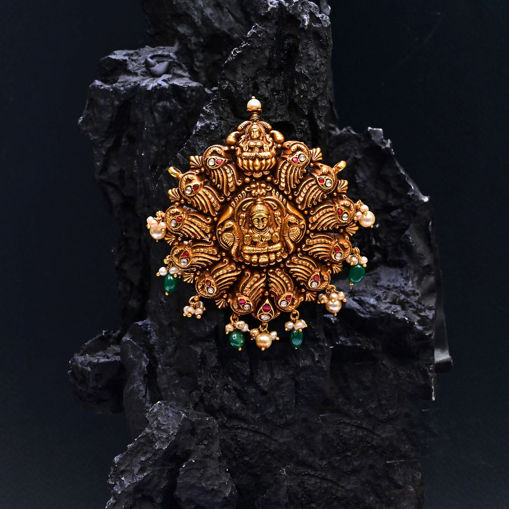 Premium 92.5 silver temple pendant featuring traditional Lakshmi motif, kemp stones, antique finish and intricate handcrafted South Indian design by Sri Fine Jewellery, Hyderabad.
(https://www.srifinejewellery.com)