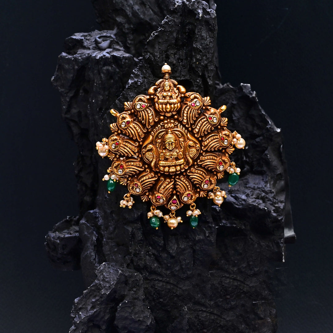 Premium 92.5 silver temple pendant featuring traditional Lakshmi motif, kemp stones, antique finish and intricate handcrafted South Indian design by Sri Fine Jewellery, Hyderabad.
(https://www.srifinejewellery.com)