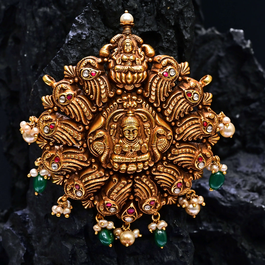 Premium 92.5 silver temple pendant featuring traditional Lakshmi motif, kemp stones, antique finish and intricate handcrafted South Indian design by Sri Fine Jewellery, Hyderabad.
(https://www.srifinejewellery.com)