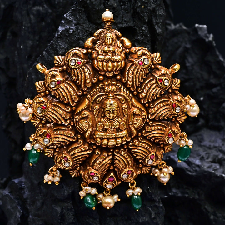 Premium 92.5 silver temple pendant featuring traditional Lakshmi motif, kemp stones, antique finish and intricate handcrafted South Indian design by Sri Fine Jewellery, Hyderabad.
(https://www.srifinejewellery.com)