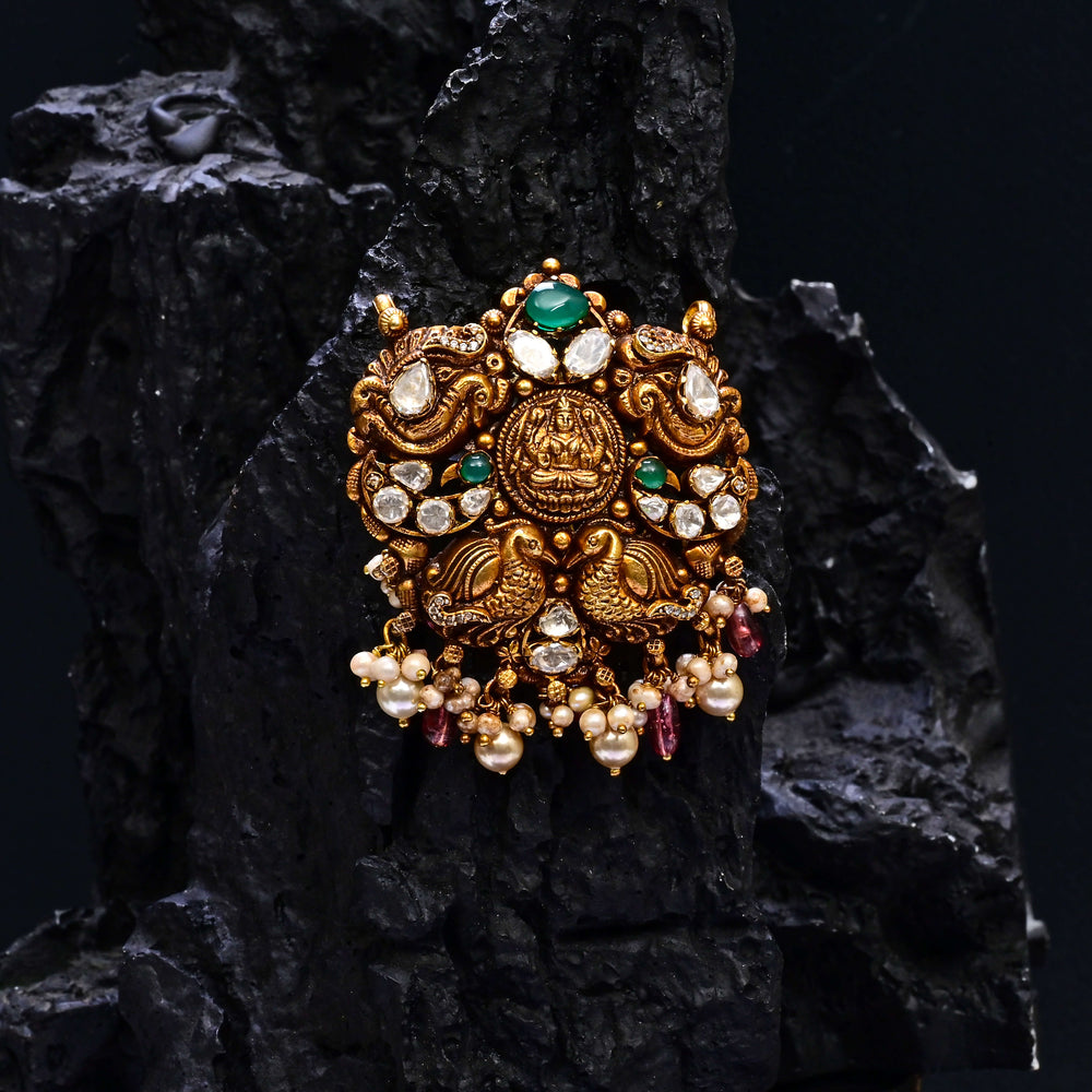 Premium 92.5 silver temple pendant featuring traditional Lakshmi motif, kemp stones, antique finish and intricate handcrafted South Indian design by Sri Fine Jewellery, Hyderabad.
(https://www.srifinejewellery.com)