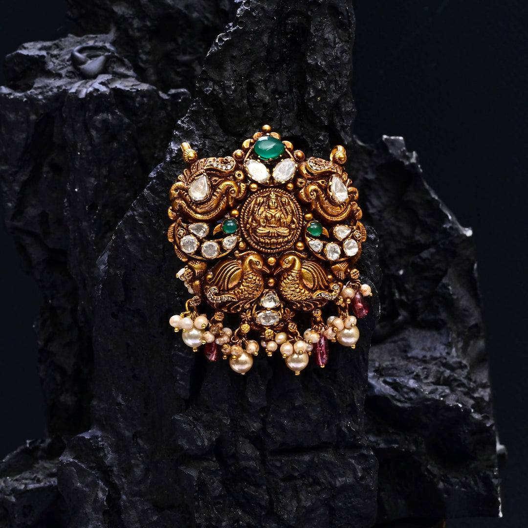 Premium 92.5 silver temple pendant featuring traditional Lakshmi motif, kemp stones, antique finish and intricate handcrafted South Indian design by Sri Fine Jewellery, Hyderabad.
(https://www.srifinejewellery.com)