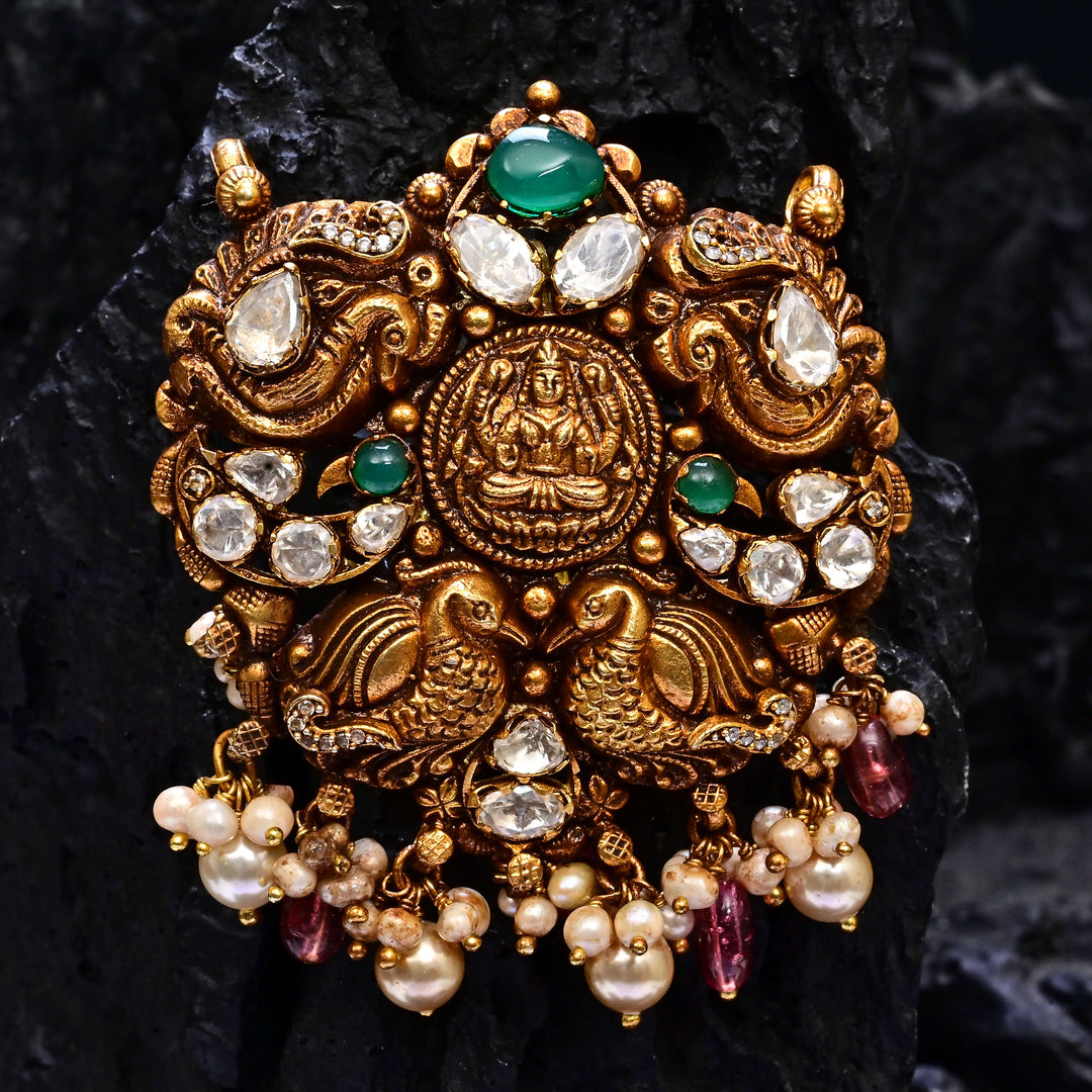 Premium 92.5 silver temple pendant featuring traditional Lakshmi motif, kemp stones, antique finish and intricate handcrafted South Indian design by Sri Fine Jewellery, Hyderabad.
(https://www.srifinejewellery.com)