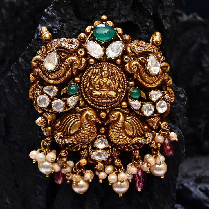 Premium 92.5 silver temple pendant featuring traditional Lakshmi motif, kemp stones, antique finish and intricate handcrafted South Indian design by Sri Fine Jewellery, Hyderabad.
(https://www.srifinejewellery.com)