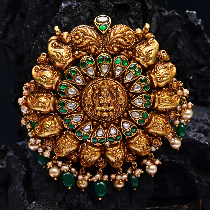 Premium 92.5 silver temple pendant featuring traditional Lakshmi motif, kemp stones, antique finish and intricate handcrafted South Indian design by Sri Fine Jewellery, Hyderabad.
(https://www.srifinejewellery.com)