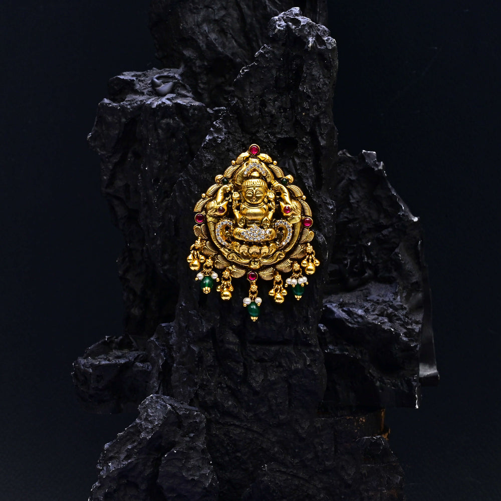 Premium 92.5 silver temple pendant featuring traditional Lakshmi motif, kemp stones, antique finish and intricate handcrafted South Indian design by Sri Fine Jewellery, Hyderabad.
(https://www.srifinejewellery.com)