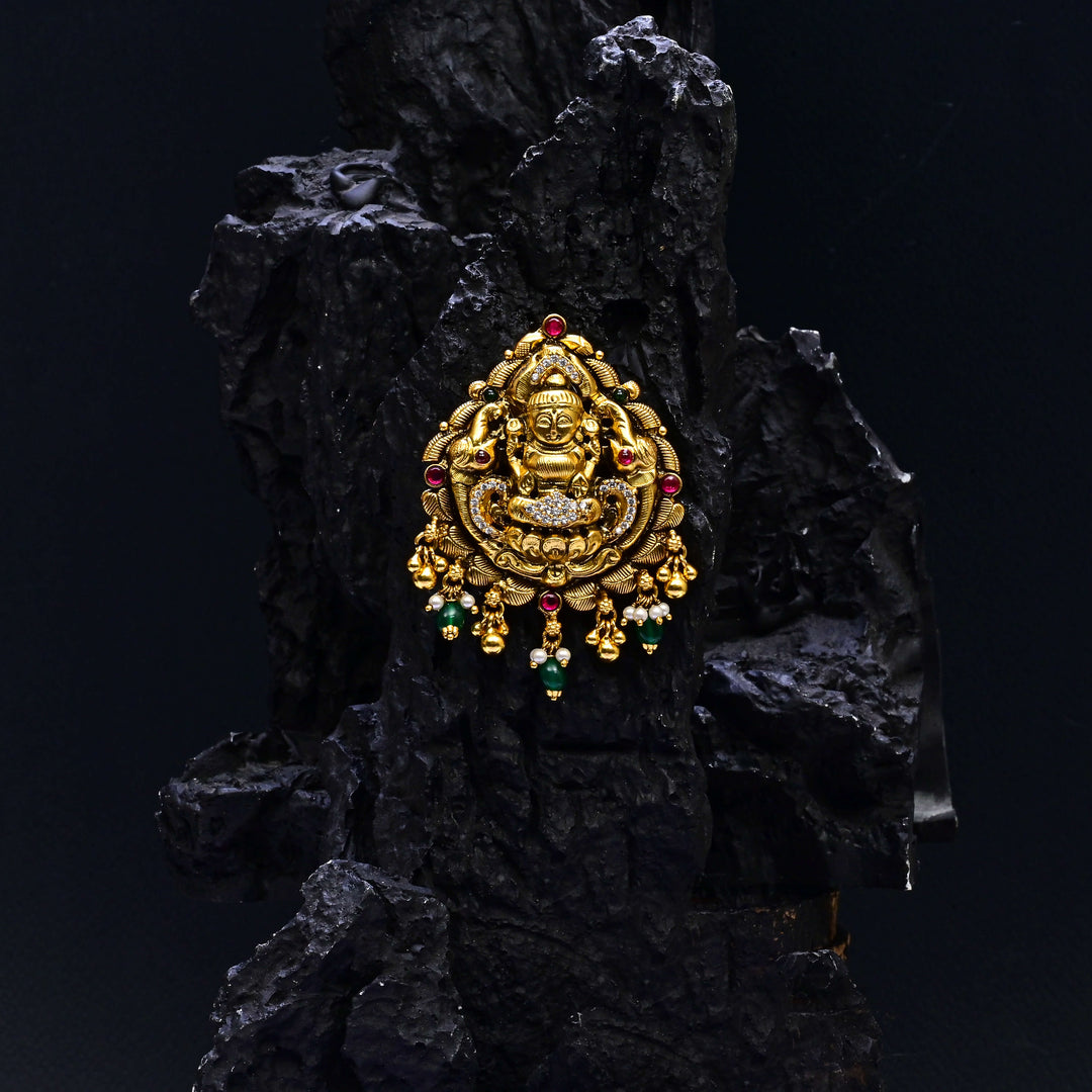 Premium 92.5 silver temple pendant featuring traditional Lakshmi motif, kemp stones, antique finish and intricate handcrafted South Indian design by Sri Fine Jewellery, Hyderabad.
(https://www.srifinejewellery.com)