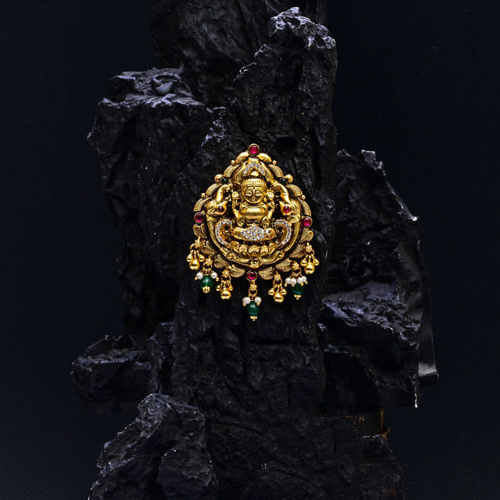 Premium 92.5 silver temple pendant featuring traditional Lakshmi motif, kemp stones, antique finish and intricate handcrafted South Indian design by Sri Fine Jewellery, Hyderabad.
(https://www.srifinejewellery.com)