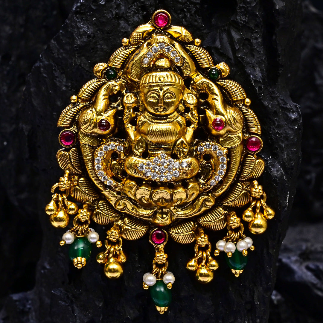 Premium 92.5 silver temple pendant featuring traditional Lakshmi motif, kemp stones, antique finish and intricate handcrafted South Indian design by Sri Fine Jewellery, Hyderabad.
(https://www.srifinejewellery.com)