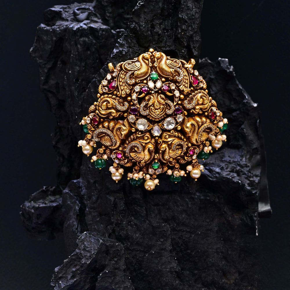 Premium 92.5 silver temple pendant featuring traditional peacock motif, kemp stones, antique finish and intricate handcrafted South Indian design by Sri Fine Jewellery, Hyderabad.
(https://www.srifinejewellery.com)