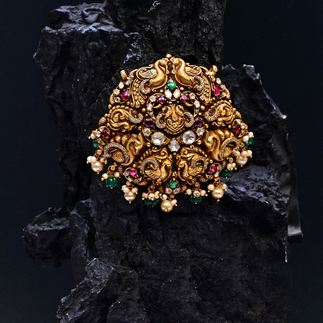 Premium 92.5 silver temple pendant featuring traditional peacock motif, kemp stones, antique finish and intricate handcrafted South Indian design by Sri Fine Jewellery, Hyderabad.
(https://www.srifinejewellery.com)