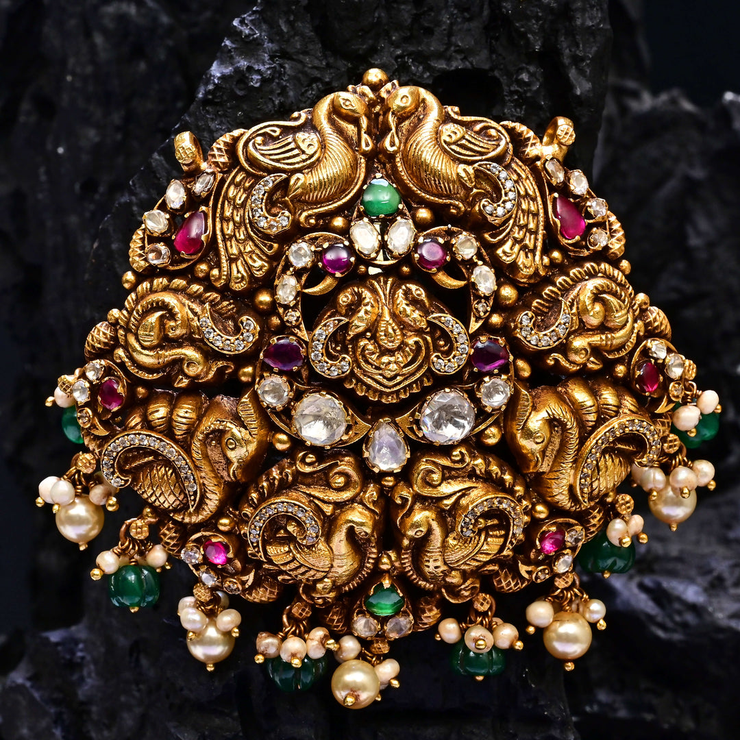 Premium 92.5 silver temple pendant featuring traditional peacock motif, kemp stones, antique finish and intricate handcrafted South Indian design by Sri Fine Jewellery, Hyderabad.
(https://www.srifinejewellery.com)