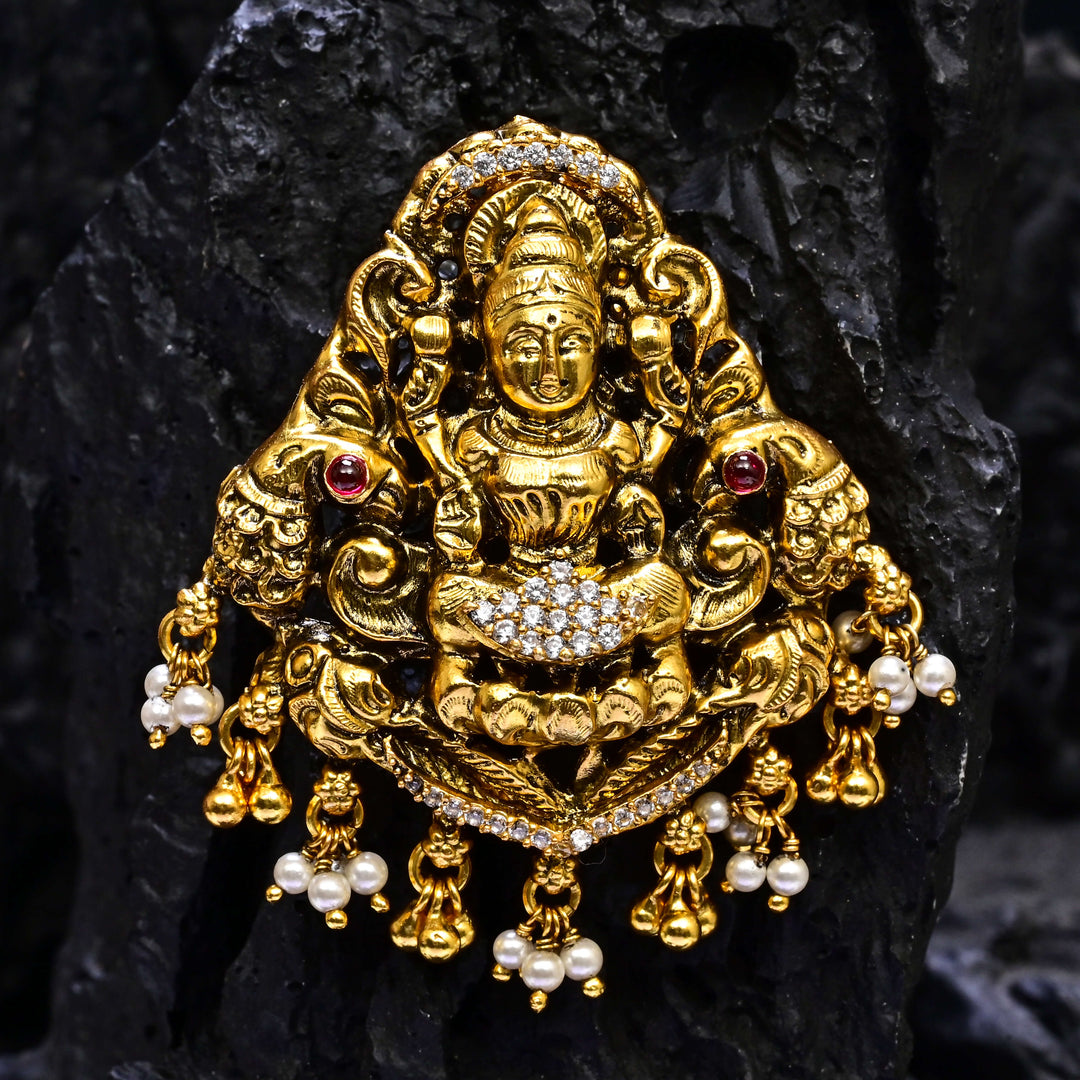 Premium 92.5 silver temple pendant featuring traditional Lakshmi motif, kemp stones, antique finish and intricate handcrafted South Indian design by Sri Fine Jewellery, Hyderabad.
(https://www.srifinejewellery.com)