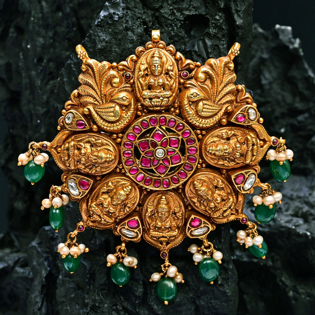 Premium 92.5 silver temple pendant featuring traditional Lakshmi motif, kemp stones, antique finish and intricate handcrafted South Indian design by Sri Fine Jewellery, Hyderabad.
(https://www.srifinejewellery.com)
