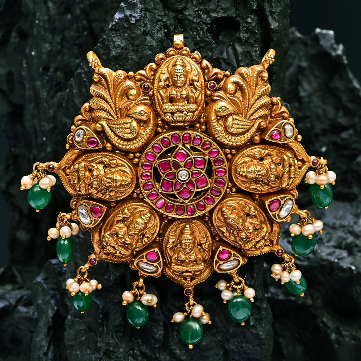 Premium 92.5 silver temple pendant featuring traditional Lakshmi motif, kemp stones, antique finish and intricate handcrafted South Indian design by Sri Fine Jewellery, Hyderabad.
(https://www.srifinejewellery.com)