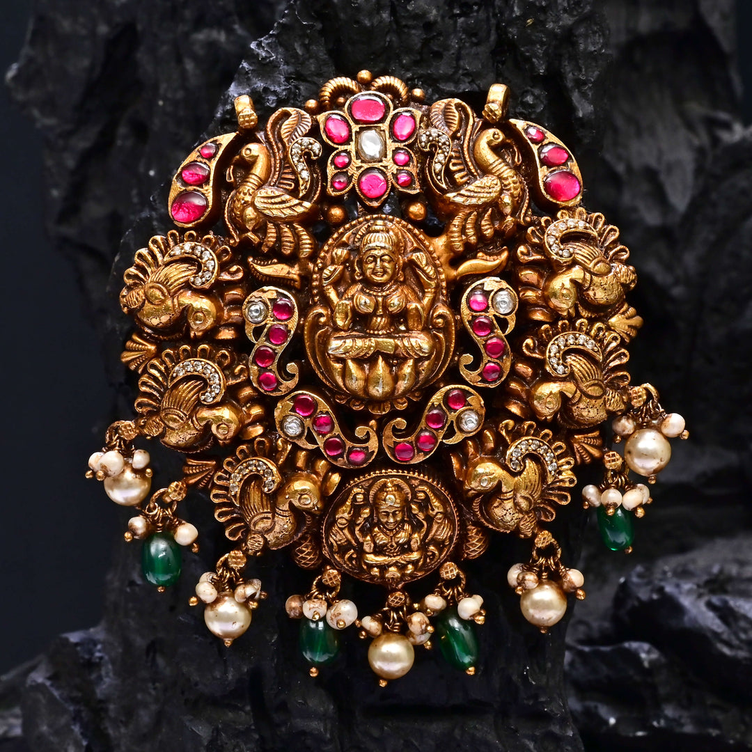 Premium 92.5 silver temple pendant featuring traditional Lakshmi motif, kemp stones, antique finish and intricate handcrafted South Indian design by Sri Fine Jewellery, Hyderabad.
(https://www.srifinejewellery.com)