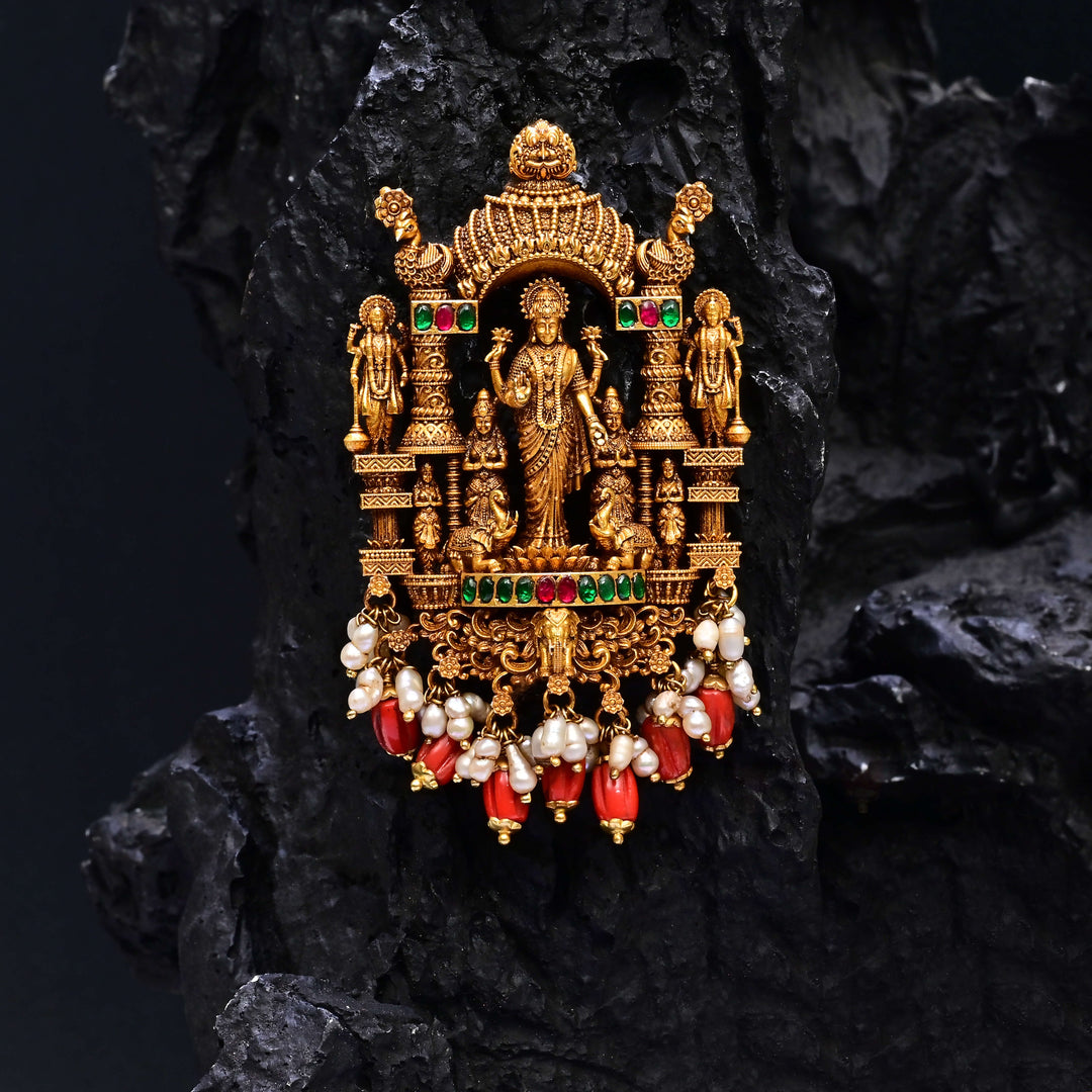 Premium 92.5 silver temple pendant featuring traditional Lakshmi motif, kemp stones, antique finish and intricate handcrafted South Indian design by Sri Fine Jewellery, Hyderabad.
(https://www.srifinejewellery.com)