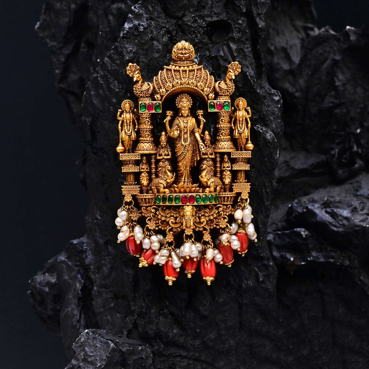 Premium 92.5 silver temple pendant featuring traditional Lakshmi motif, kemp stones, antique finish and intricate handcrafted South Indian design by Sri Fine Jewellery, Hyderabad.
(https://www.srifinejewellery.com)