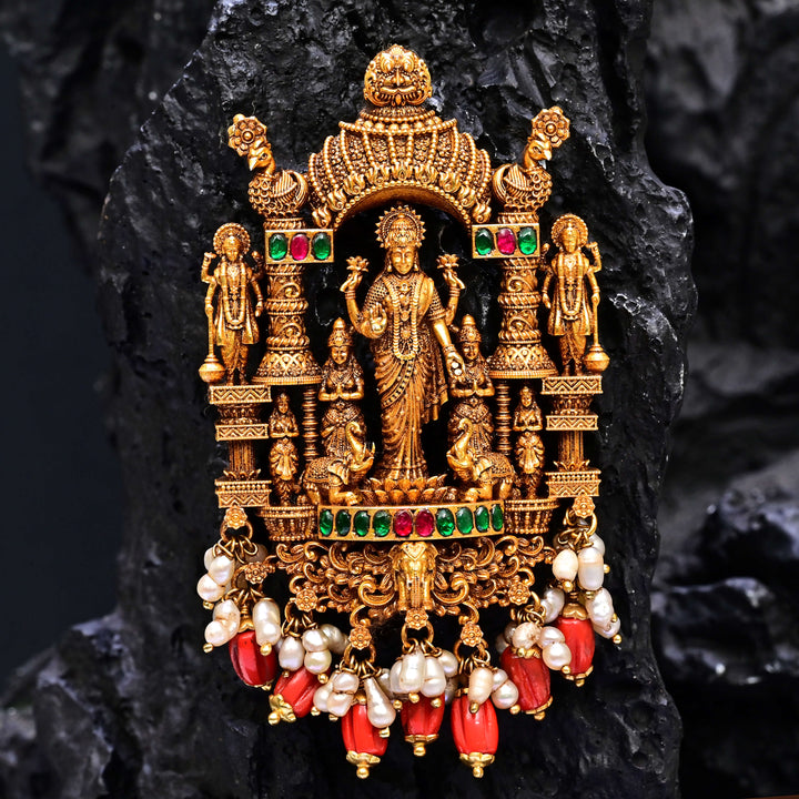Premium 92.5 silver temple pendant featuring traditional Lakshmi motif, kemp stones, antique finish and intricate handcrafted South Indian design by Sri Fine Jewellery, Hyderabad.
(https://www.srifinejewellery.com)