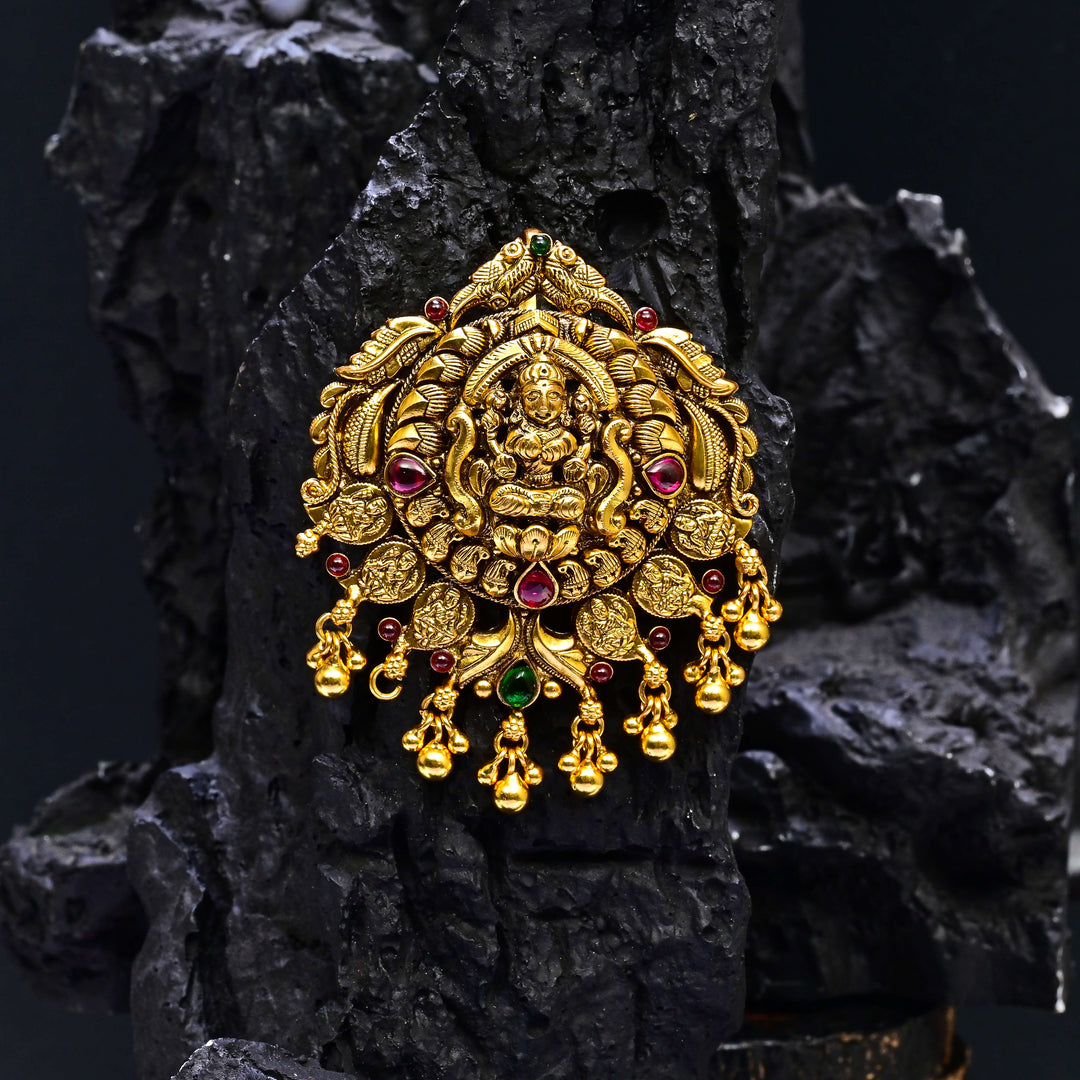 Premium 92.5 silver temple pendant featuring traditional Lakshmi motif, kemp stones, antique finish and intricate handcrafted South Indian design by Sri Fine Jewellery, Hyderabad.
(https://www.srifinejewellery.com)