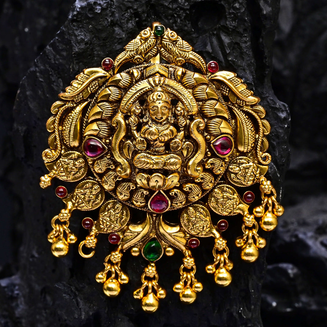 Premium 92.5 silver temple pendant featuring traditional Lakshmi motif, kemp stones, antique finish and intricate handcrafted South Indian design by Sri Fine Jewellery, Hyderabad.
(https://www.srifinejewellery.com)