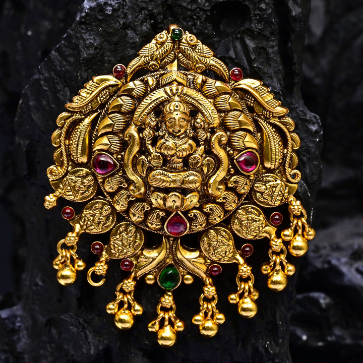 Premium 92.5 silver temple pendant featuring traditional Lakshmi motif, kemp stones, antique finish and intricate handcrafted South Indian design by Sri Fine Jewellery, Hyderabad.
(https://www.srifinejewellery.com)