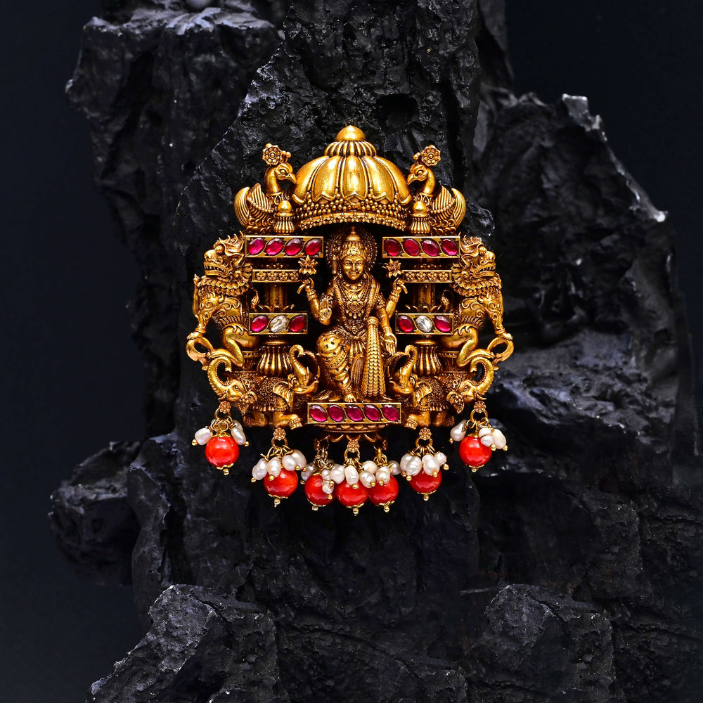 Premium 92.5 silver temple pendant featuring traditional Lakshmi motif, kemp stones, antique finish and intricate handcrafted South Indian design by Sri Fine Jewellery, Hyderabad.
(https://www.srifinejewellery.com)